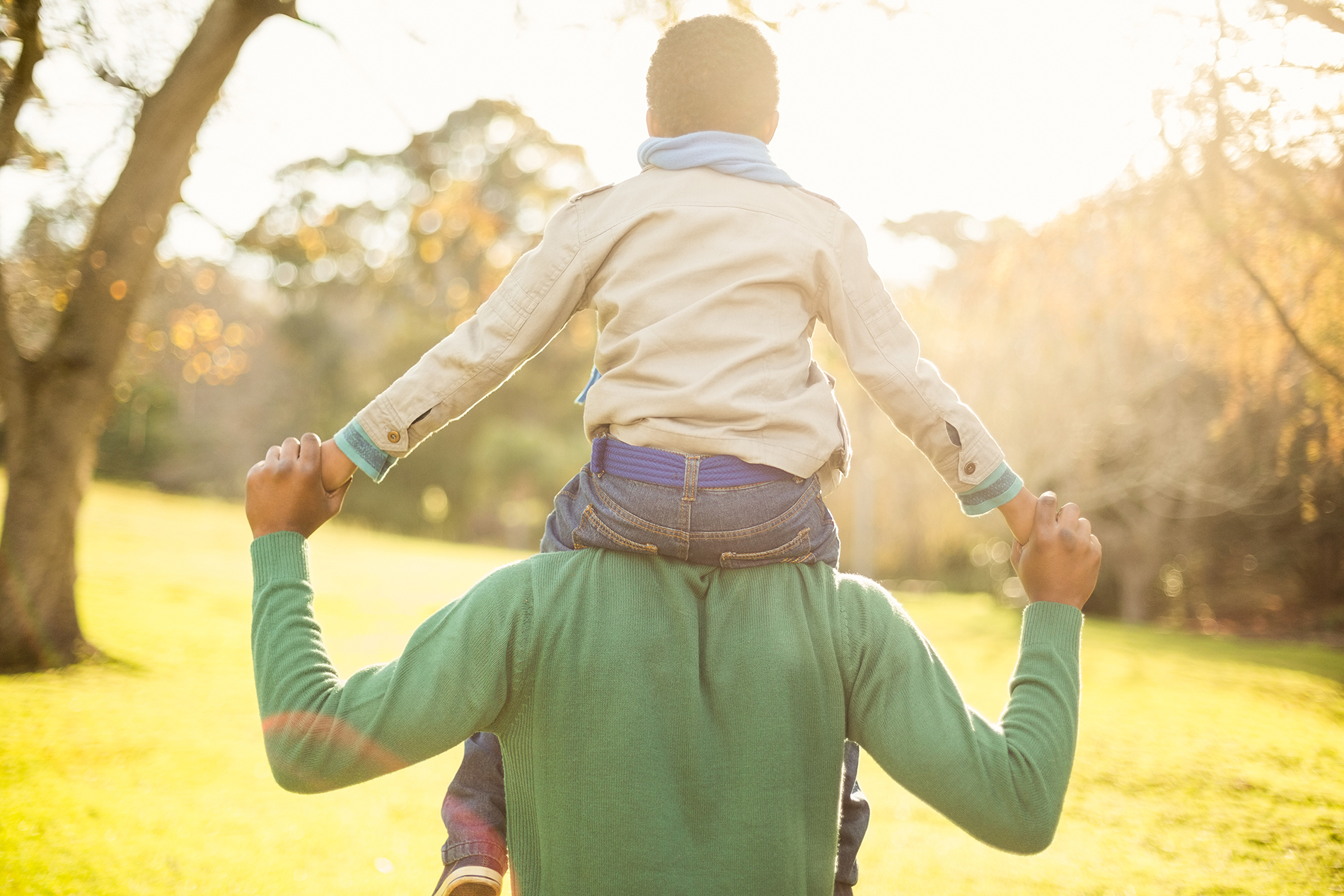 rear-view-of-a-father-with-his-son-in-piggyback-on-2026-01-09-08-35-27-utc